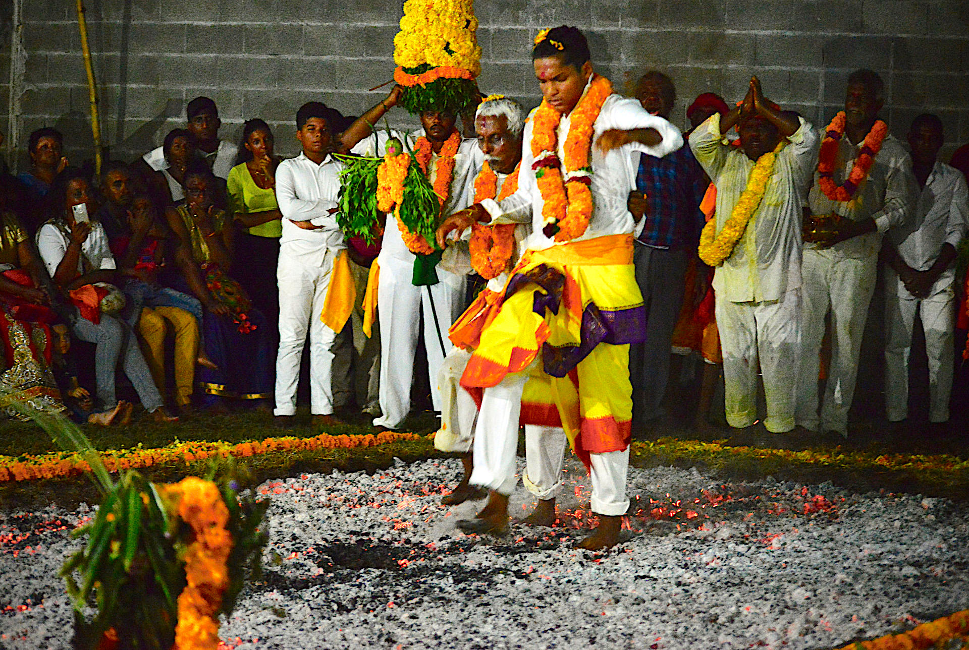 Fire-walking penitents. Moutaye family temple, Terre-Sainte, January 2020. Photo by William Tallotte.